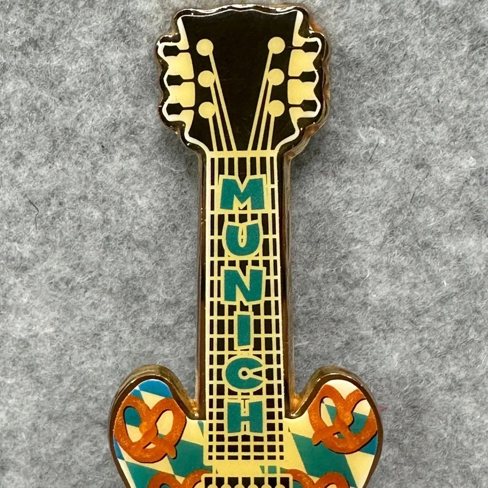 RARE Hard Rock Cafe Munich Guitar Shaped Bottle Opener Pretzel Design